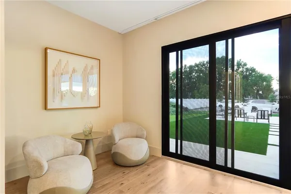 a bedroom with a bed and wall painting