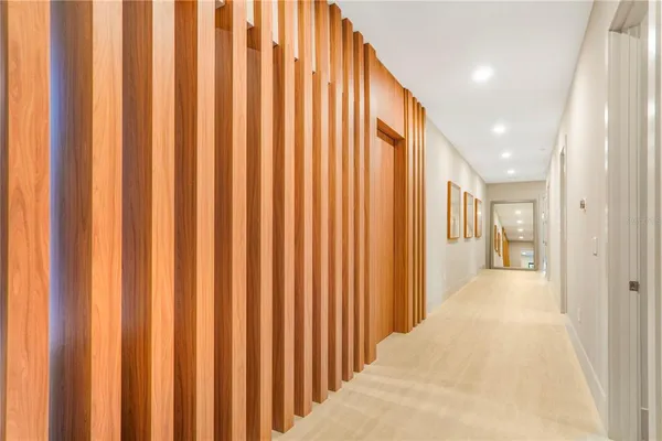 a bedroom with two beds and painting on the wall