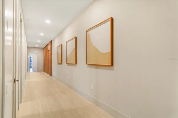 a bedroom with a bed and wall painting