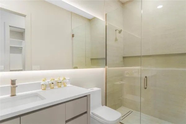 a bedroom with a bed and a chair