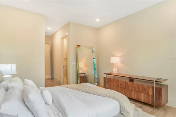 a bedroom with a bed and a lamp