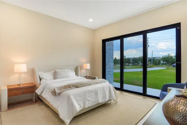 a blue kitchen with a table chairs and a flat screen tv