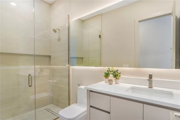 a view of a house with swimming pool and sitting area