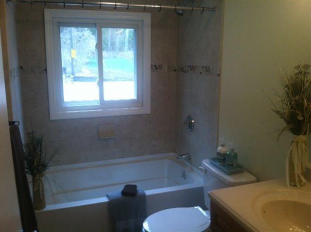 9 Alden Road Wareham, MA 02571 - Photo 5 of 22 a bath room with a toilet and a bath tub