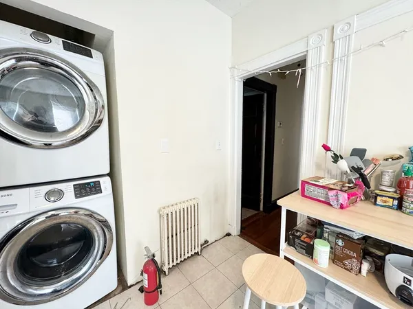 a utility room with sink dryer and washer