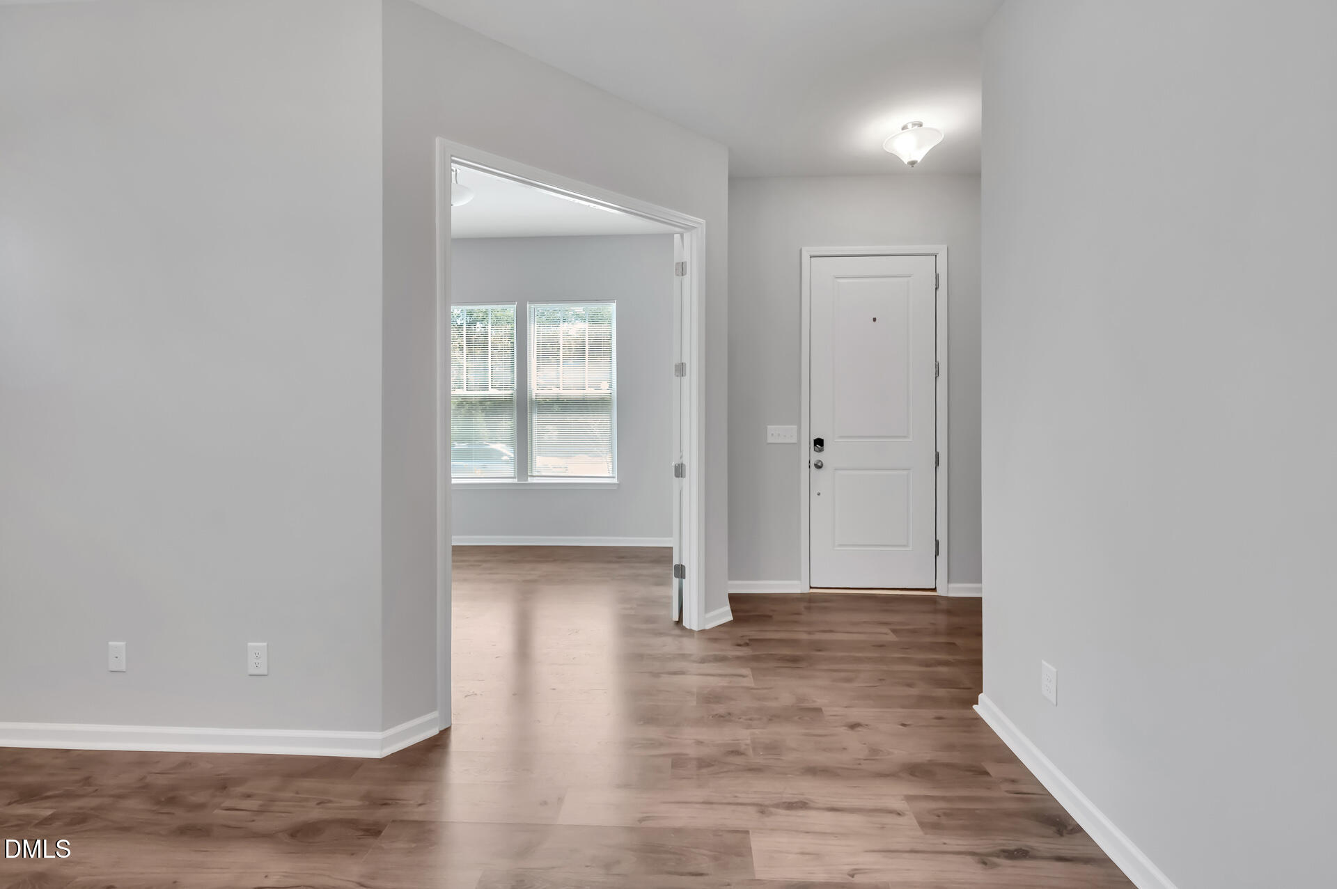 5406 Ripplebrook Drive Durham, NC 27712 - Photo 4 of 37 wooden floor with white walls