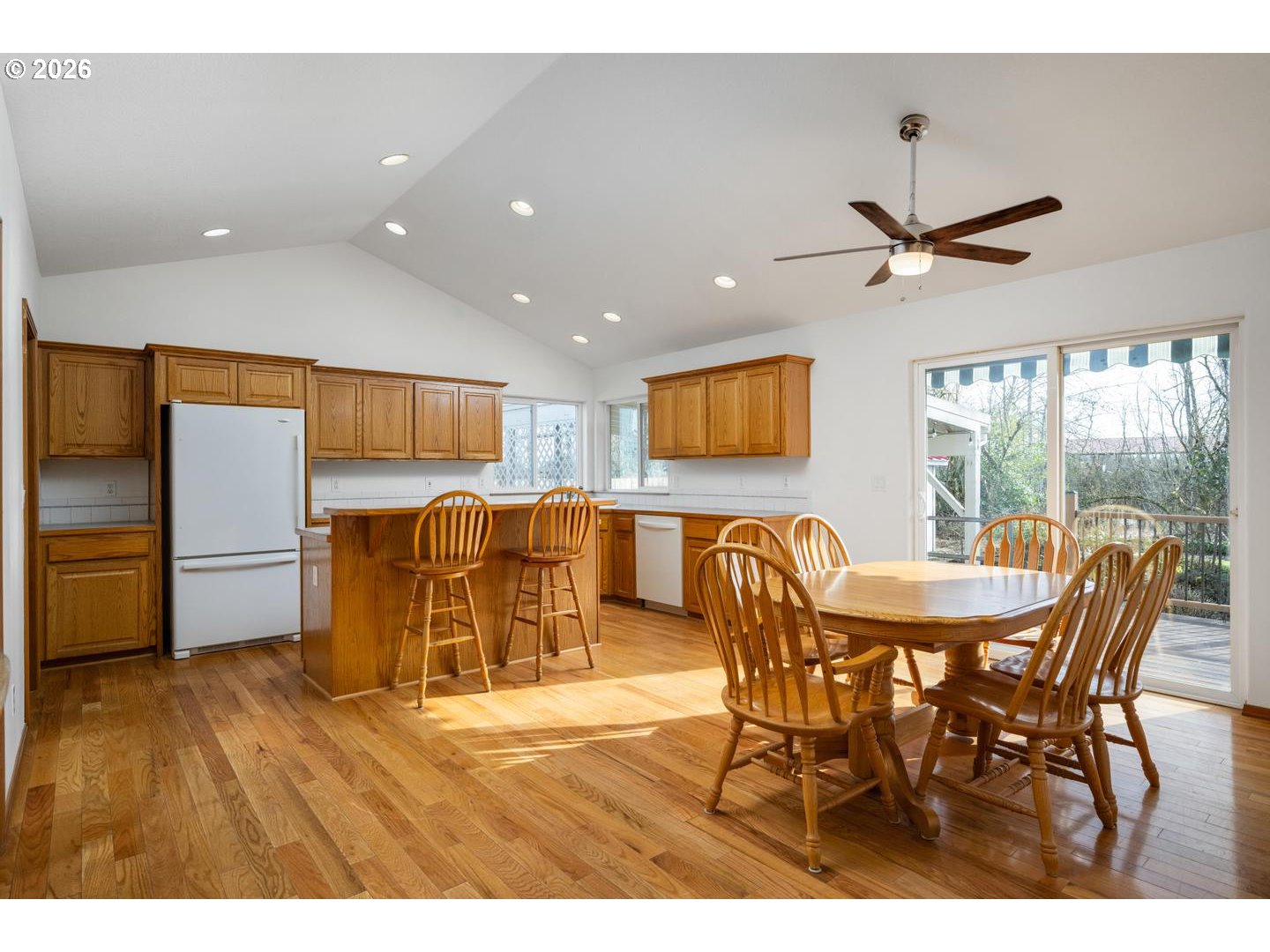 52364 Northeast 14th Scappoose, OR 97056 - Photo 11 of 42 a view of a dining room with furniture window and wooden floor