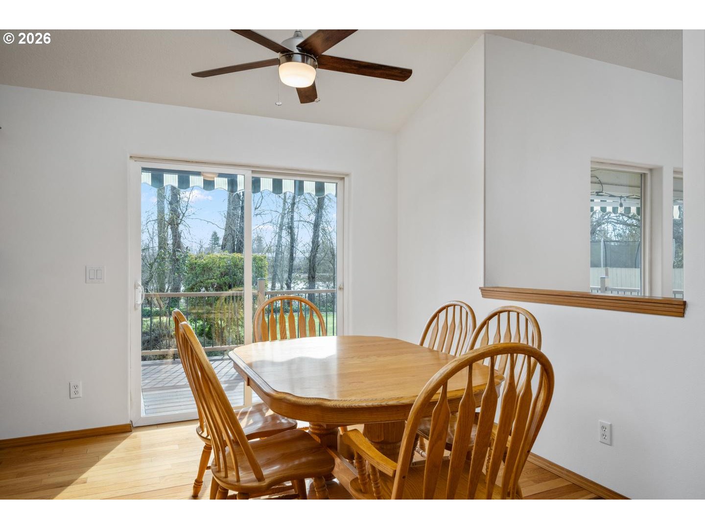 52364 Northeast 14th Scappoose, OR 97056 - Photo 13 of 42 a view of a dining room with furniture and a window