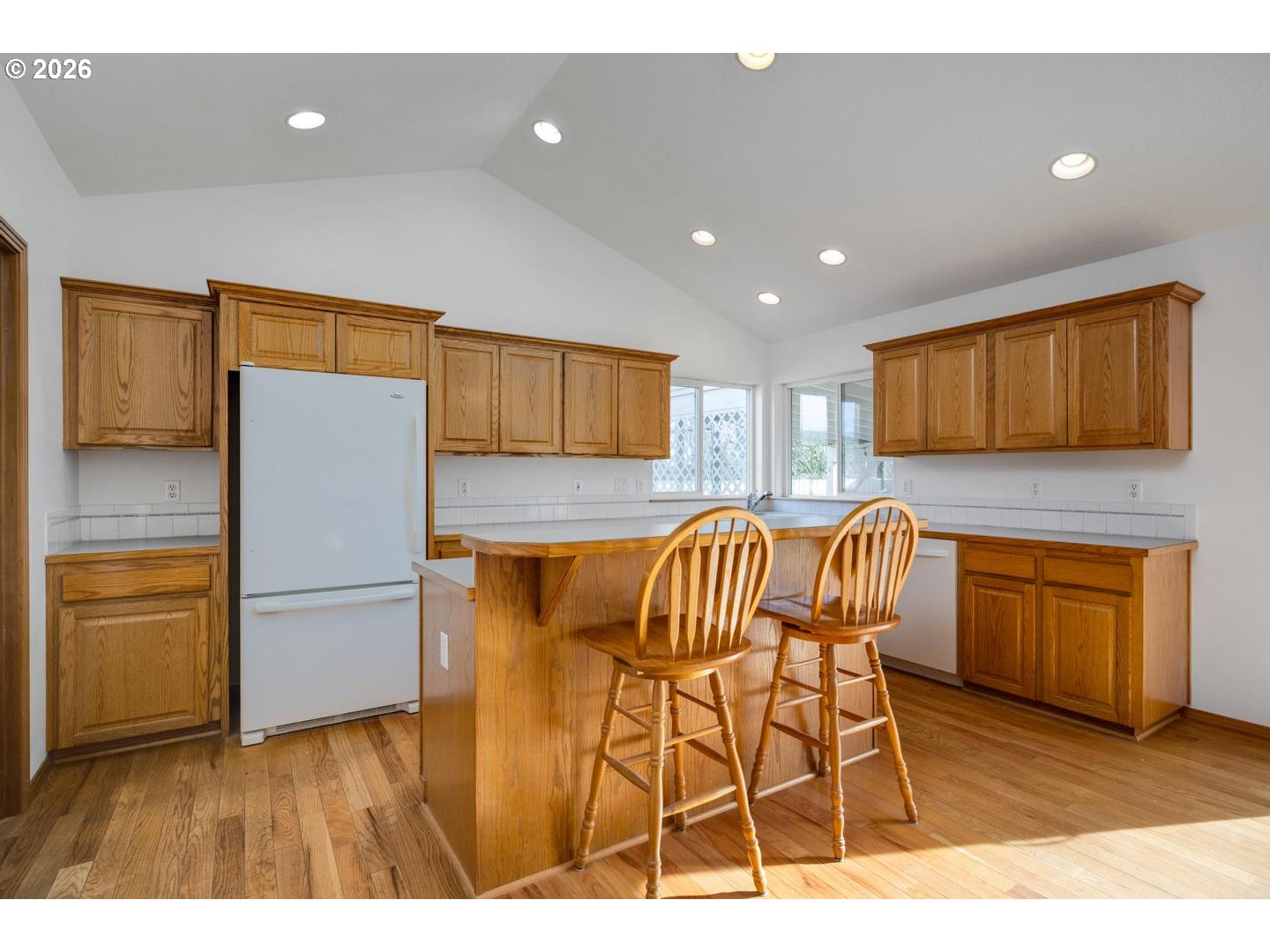 52364 Northeast 14th Scappoose, OR 97056 - Photo 15 of 42 a kitchen with granite countertop wooden cabinets and stainless steel appliances