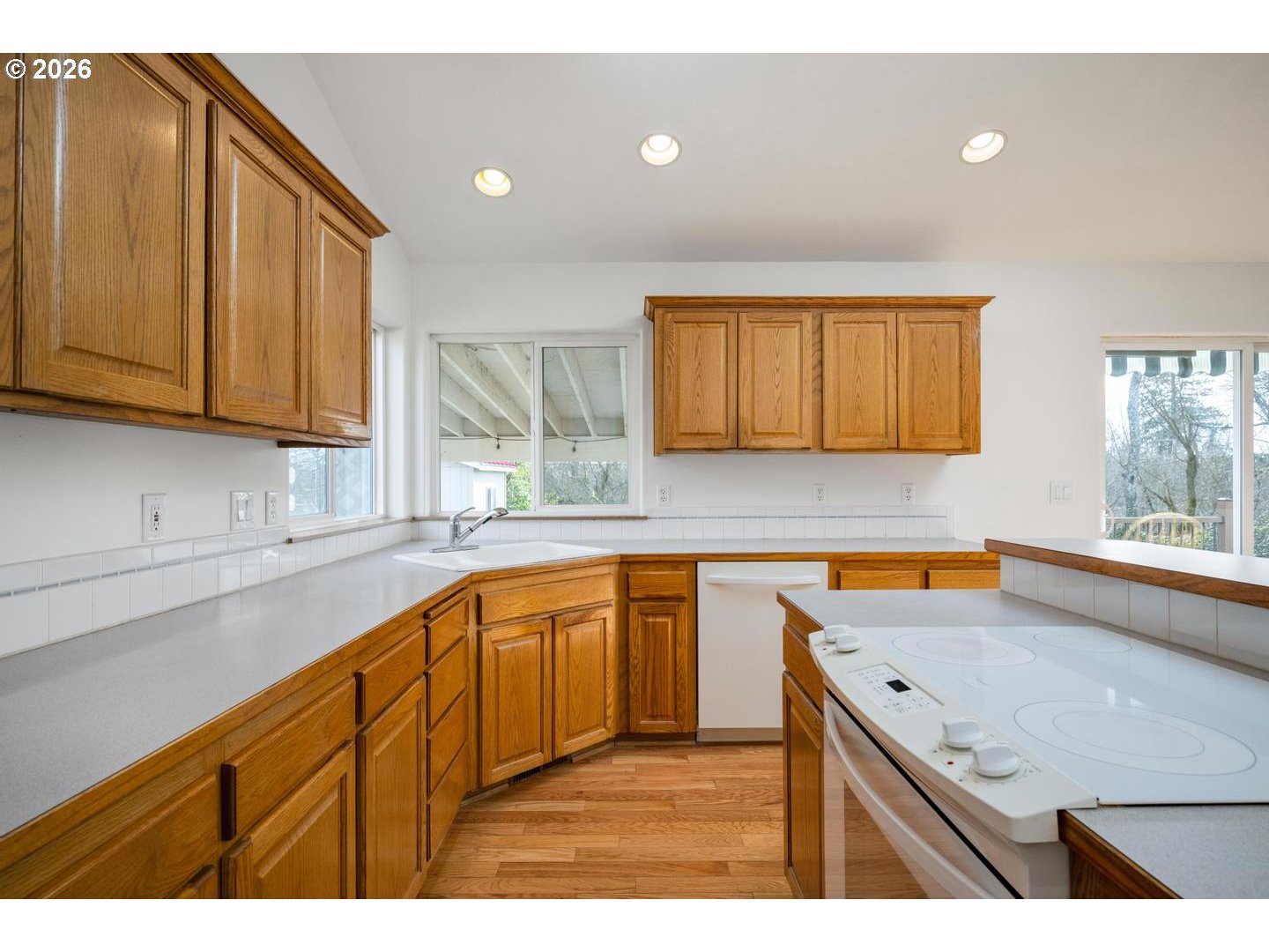 52364 Northeast 14th Scappoose, OR 97056 - Photo 17 of 42 a kitchen with stainless steel appliances granite countertop wooden cabinets a sink and dishwasher