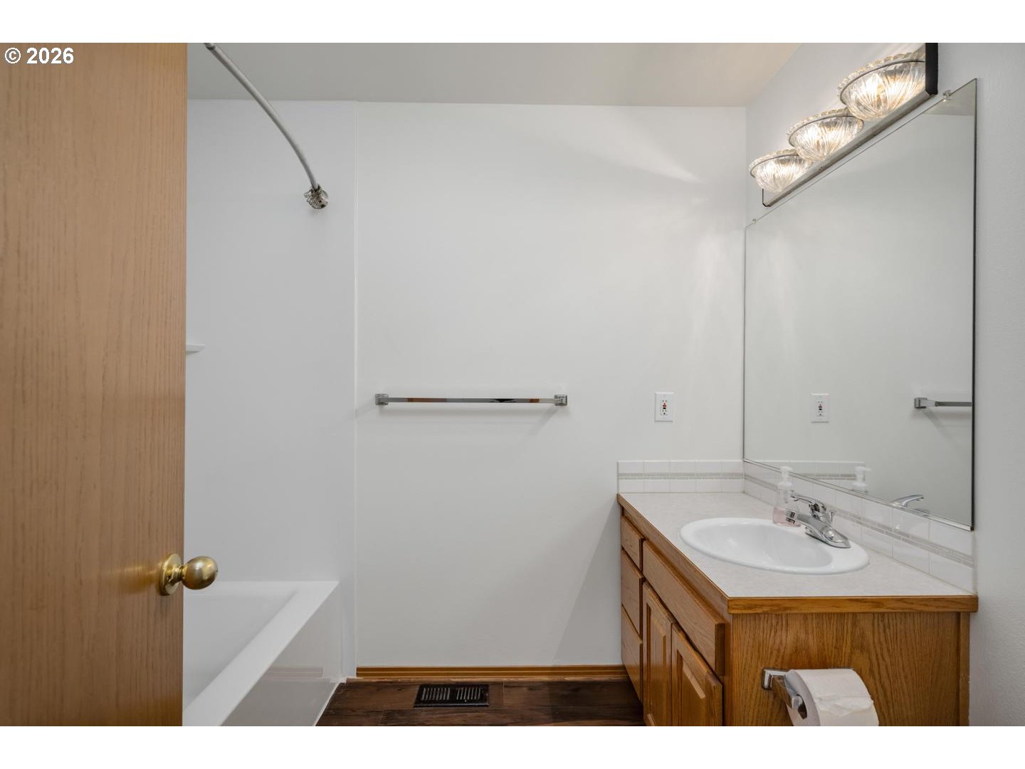 52364 Northeast 14th Scappoose, OR 97056 - Photo 23 of 42 a bathroom with a sink vanity and a mirror