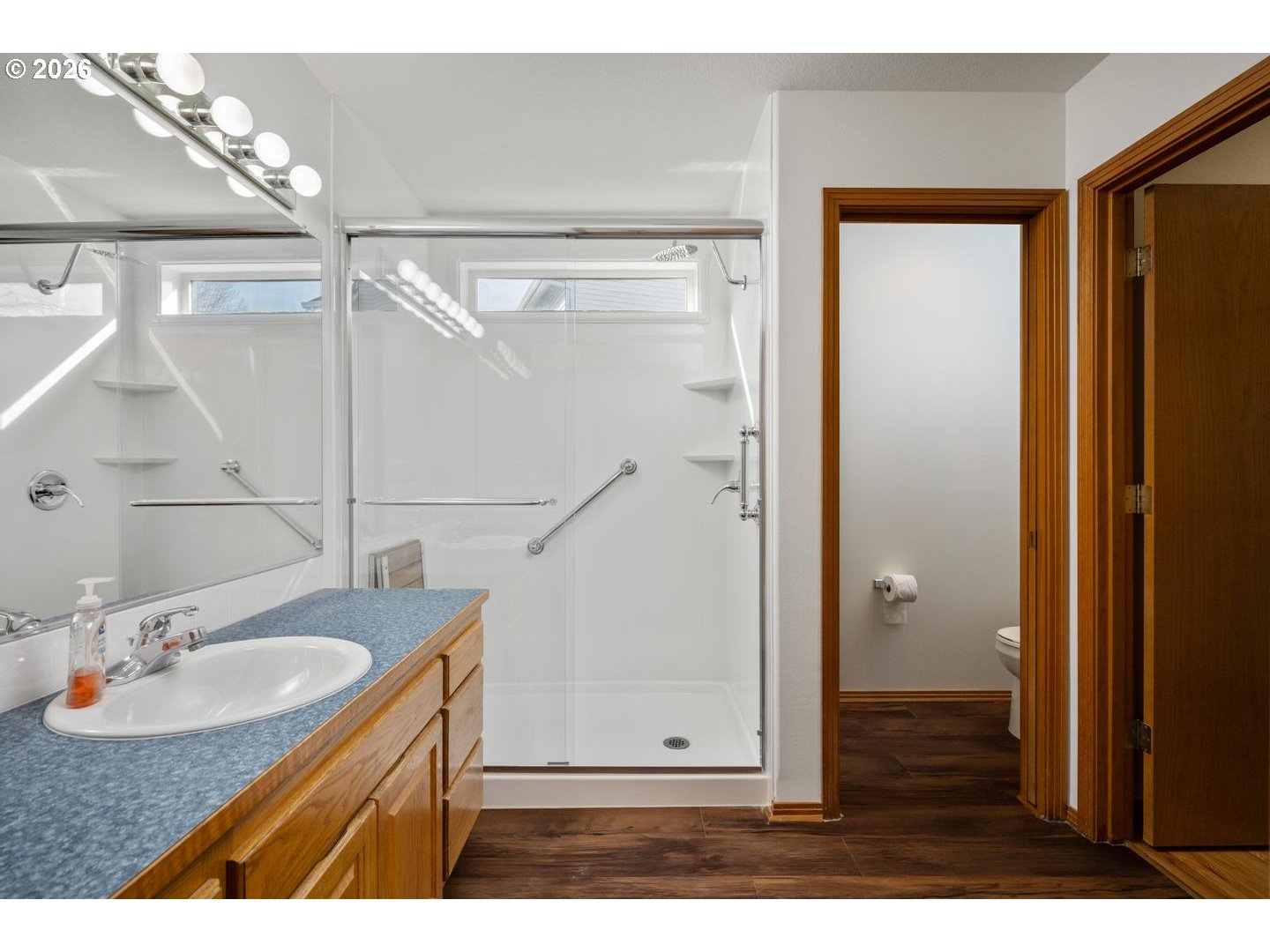 52364 Northeast 14th Scappoose, OR 97056 - Photo 27 of 42 a bathroom with a sink a mirror and shower