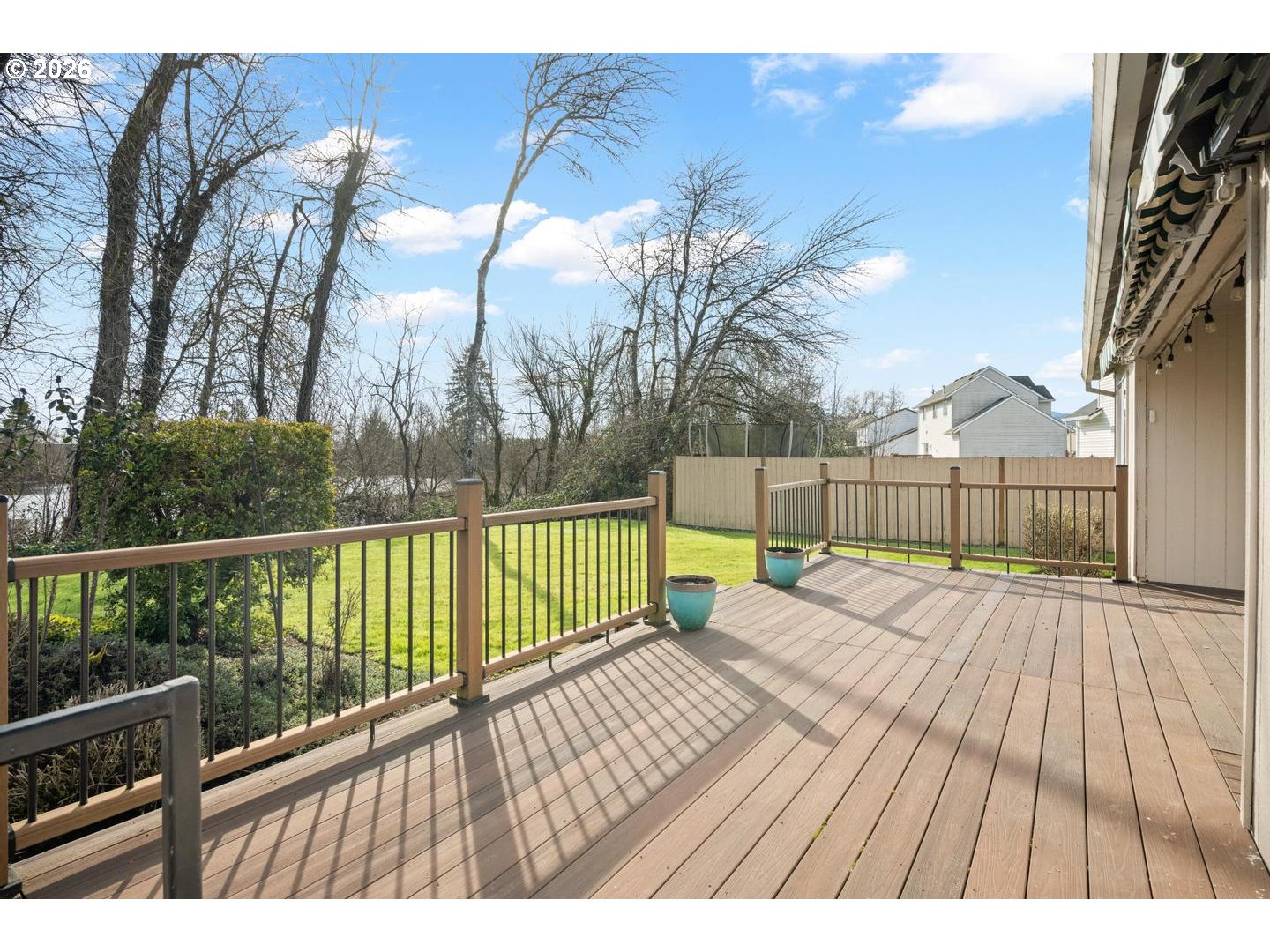 52364 Northeast 14th Scappoose, OR 97056 - Photo 32 of 42 a view of a balcony with wooden floor and fence