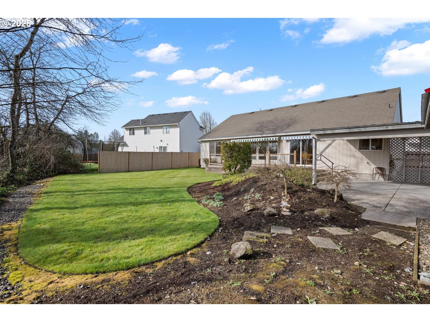 52364 Northeast 14th Scappoose, OR 97056 - Photo 39 of 42 a view of a white house with a big yard and potted plants