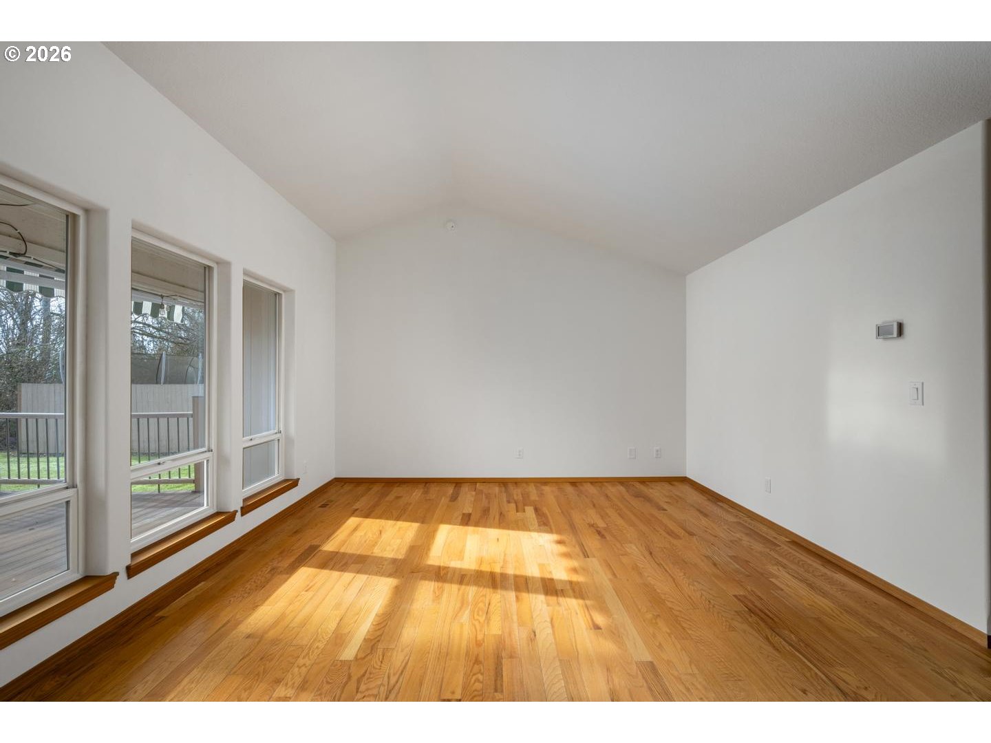 52364 Northeast 14th Scappoose, OR 97056 - Photo 8 of 42 a view of an empty room and wooden floor