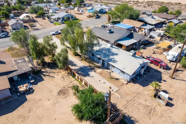 an aerial view of residential houses with outdoor space