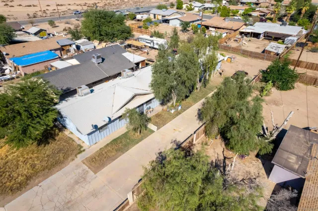 an aerial view of residential houses with outdoor space