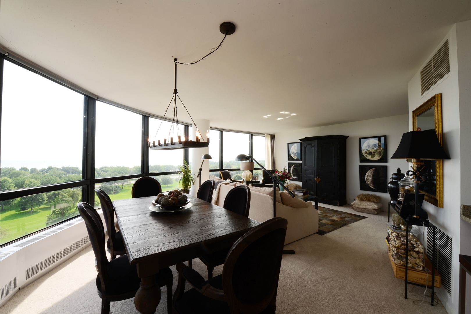 5415 North Sheridan Road, Unit 806 Chicago, IL 60640 - Photo 3 of 16 a view of a dining room with furniture window and outside view