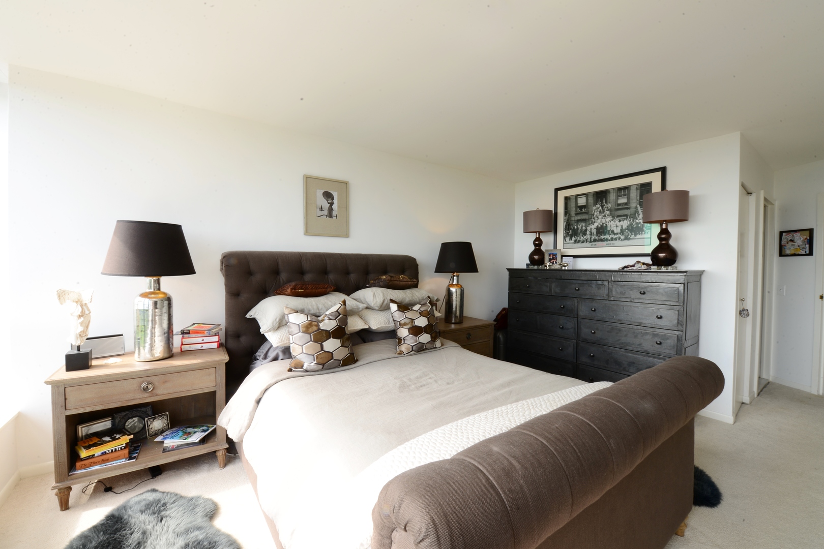 5415 North Sheridan Road, Unit 806 Chicago, IL 60640 - Photo 10 of 16 a bed room with a bed and a night stand
