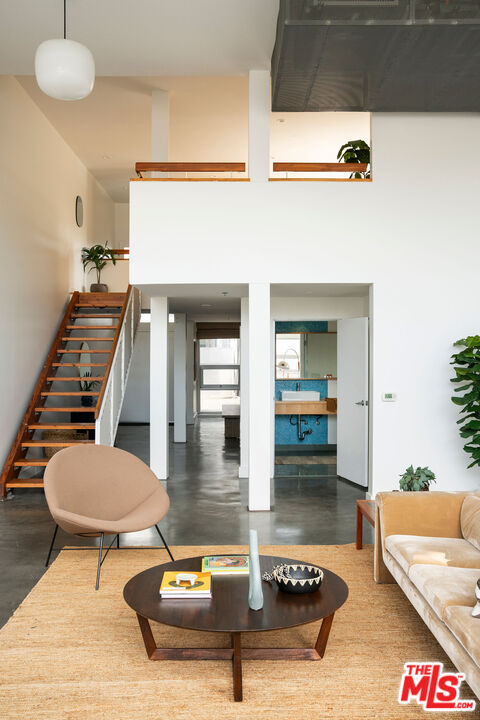615 Hampton Drive, Unit A101 Venice, CA 90291 - Photo 11 of 24 a living room with furniture and a potted plant