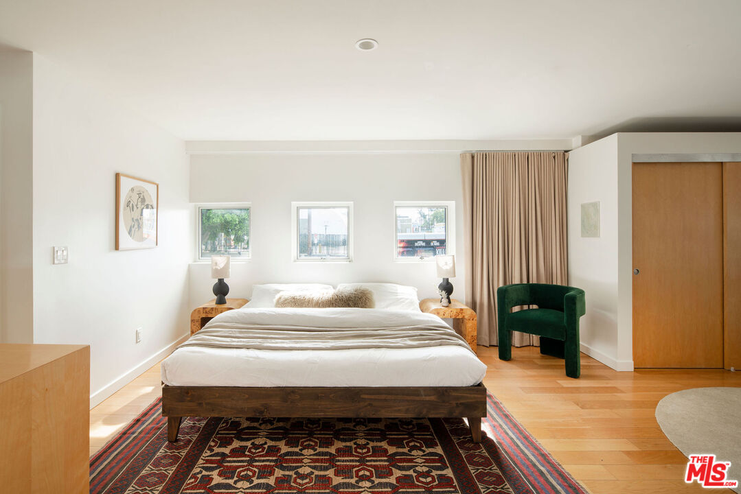 615 Hampton Drive, Unit A101 Venice, CA 90291 - Photo 13 of 24 a bedroom with a bed and a couch