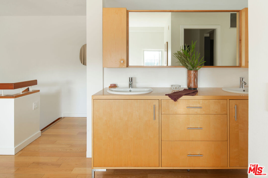 615 Hampton Drive, Unit A101 Venice, CA 90291 - Photo 16 of 24 a bathroom with a sink and a mirror