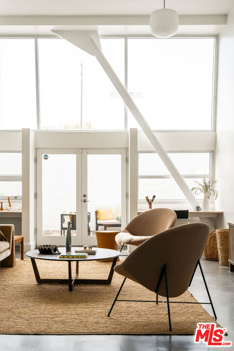 615 Hampton Drive, Unit A101 Venice, CA 90291 - Photo 18 of 24 a living room filled with furniture and a large window