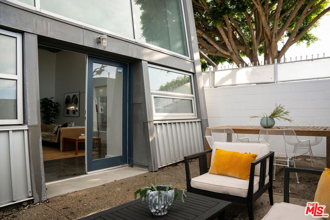 615 Hampton Drive, Unit A101 Venice, CA 90291 - Photo 19 of 24 a outdoor space with patio the couch and table