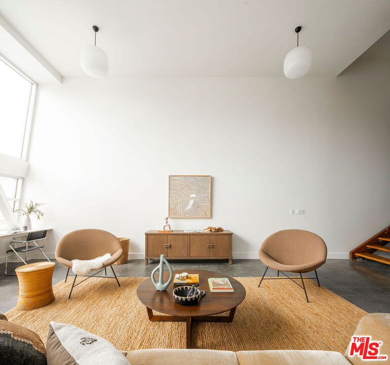 615 Hampton Drive, Unit A101 Venice, CA 90291 - Photo 4 of 24 a living room with furniture and a rug