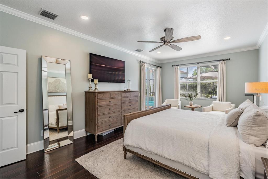 2730 Manning Drive Trinity, FL 34655 - Photo 18 of 43 a bedroom with a bed and a flat screen tv