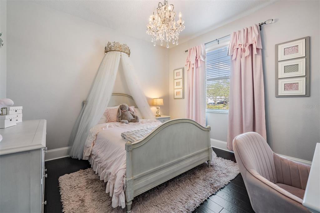 2730 Manning Drive Trinity, FL 34655 - Photo 22 of 43 a bed room with a bed and a chair