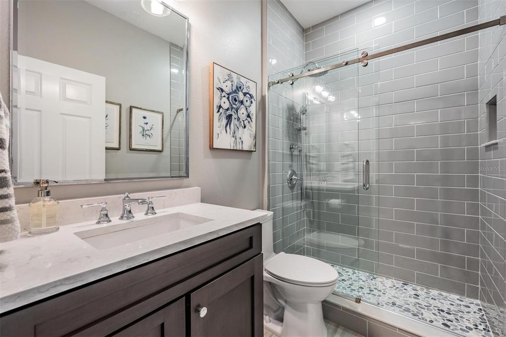 2730 Manning Drive Trinity, FL 34655 - Photo 23 of 43 a bathroom with a sink a toilet and shower