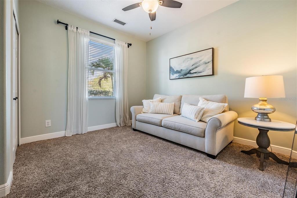 2730 Manning Drive Trinity, FL 34655 - Photo 24 of 43 a living room with furniture and a lamp