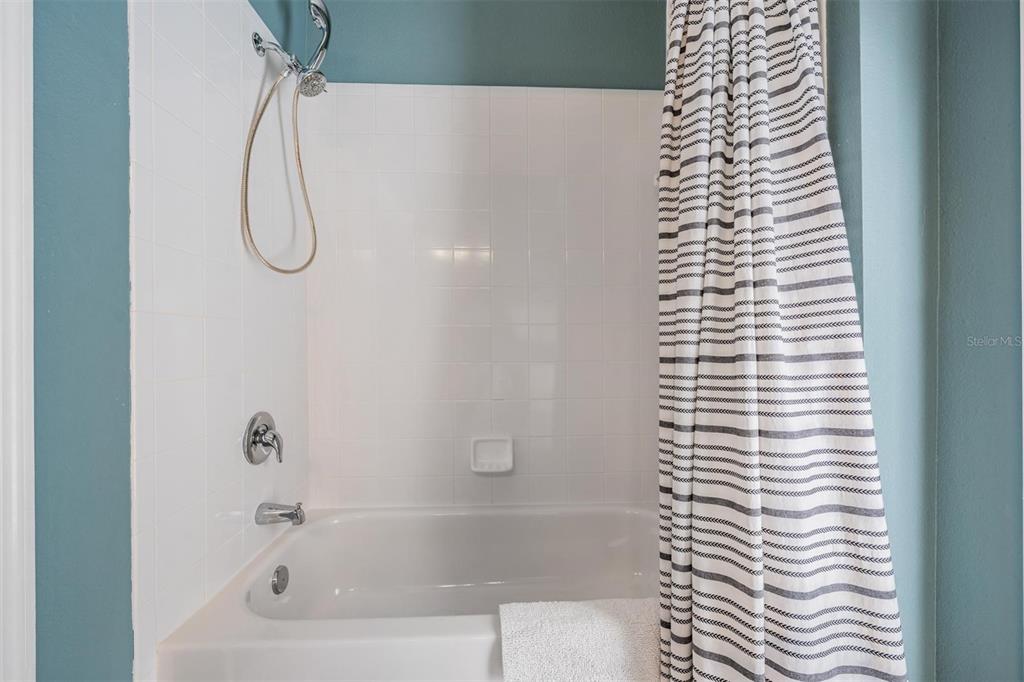 2730 Manning Drive Trinity, FL 34655 - Photo 27 of 43 a bathroom with a bathtub and a shower