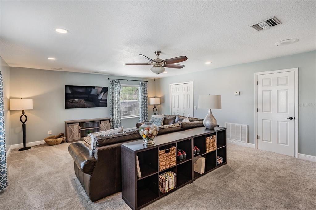 2730 Manning Drive Trinity, FL 34655 - Photo 31 of 43 a living room with furniture and a ceiling fan