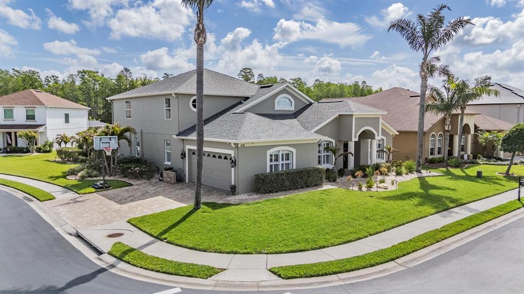 2730 Manning Drive Trinity, FL 34655 - Photo 36 of 43 a view of a house with a swimming pool and a yard