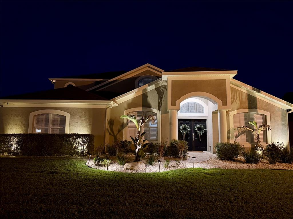 2730 Manning Drive Trinity, FL 34655 - Photo 37 of 43 a front view of a house with a yard