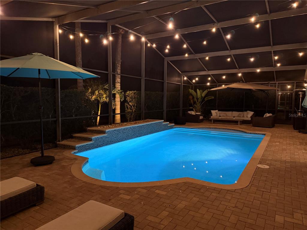 2730 Manning Drive Trinity, FL 34655 - Photo 39 of 43 a view of a swimming pool with an outdoor space and sitting area