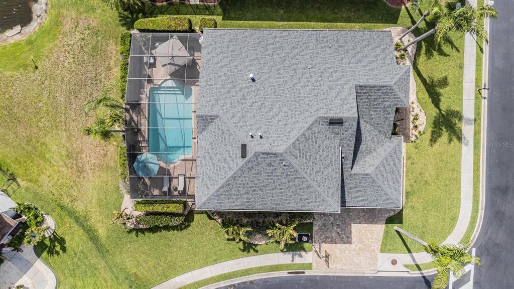 2730 Manning Drive Trinity, FL 34655 - Photo 4 of 43 an aerial view of a house with swimming pool and large trees