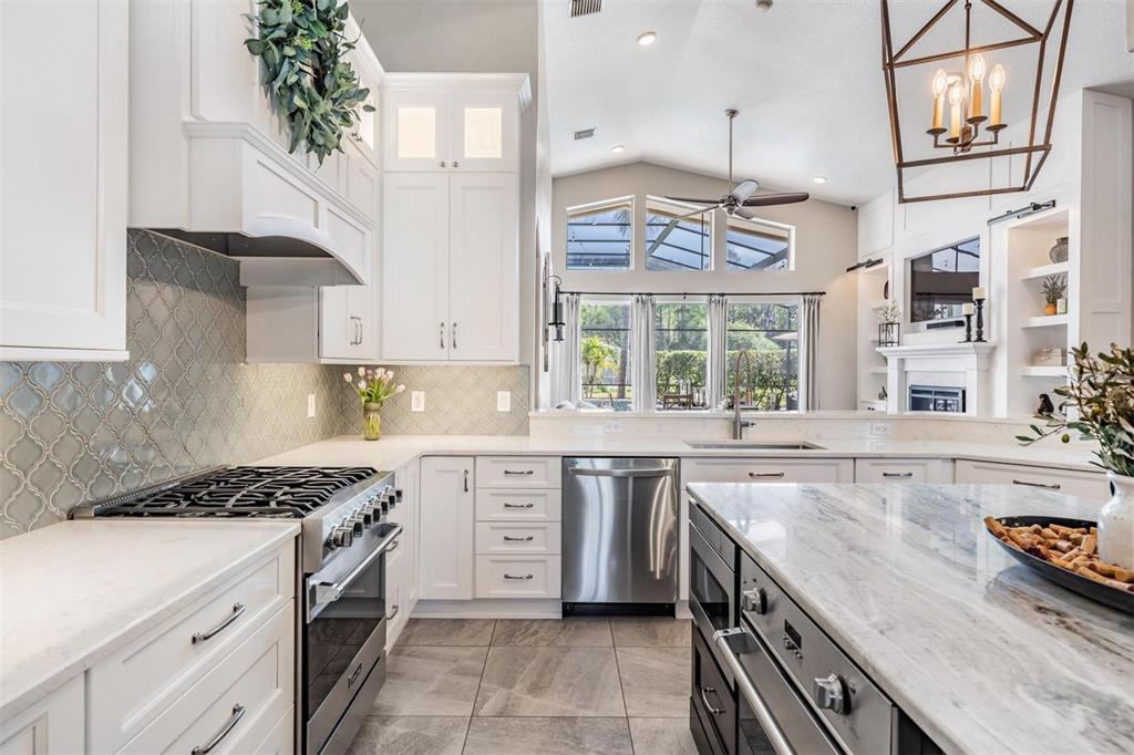 2730 Manning Drive Trinity, FL 34655 - Photo 10 of 43 a kitchen that has a lot of cabinets in it