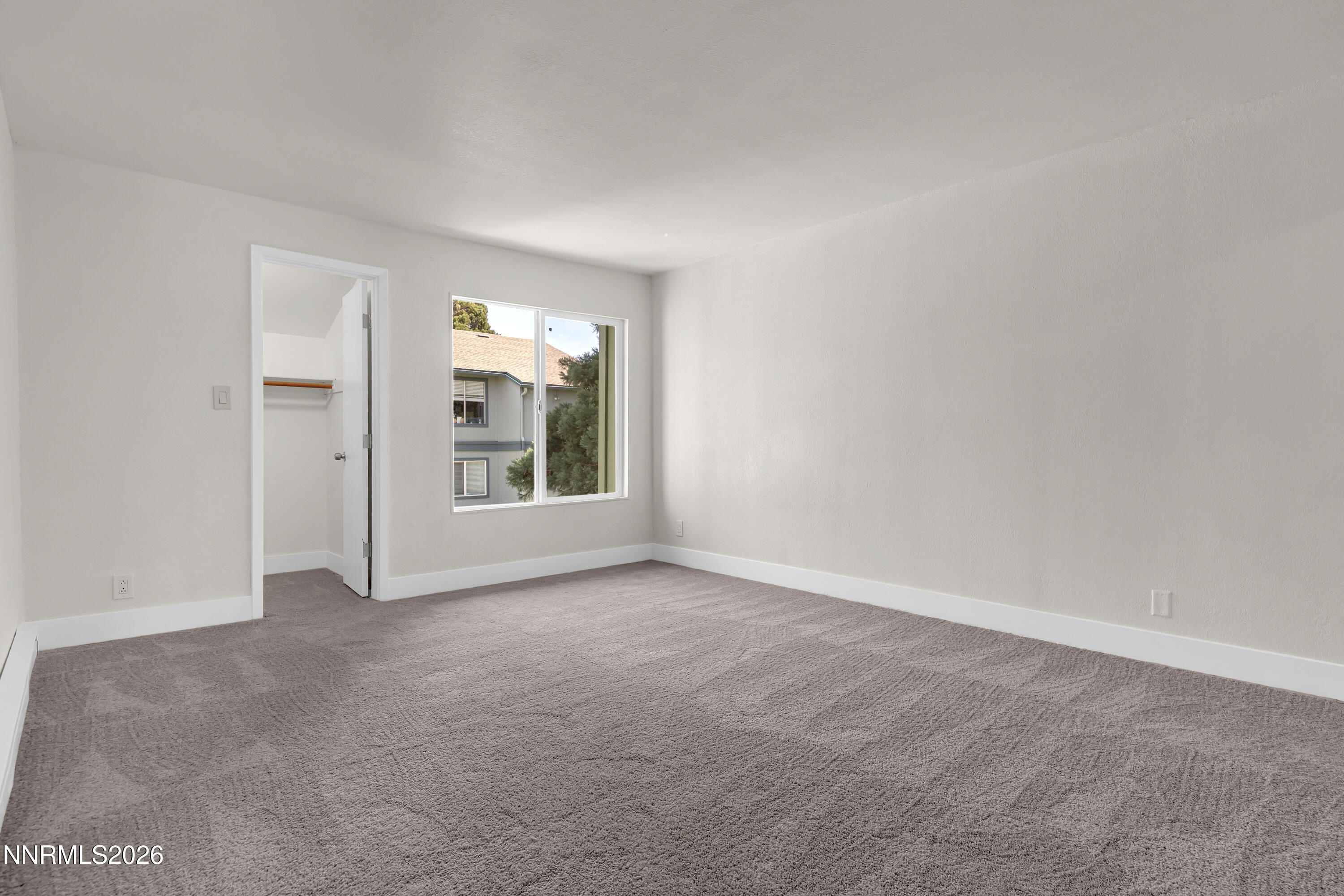 3905 Clear Acre Lane, Unit 26 Reno, NV 89512 - Photo 17 of 27 an empty room with windows and entrance