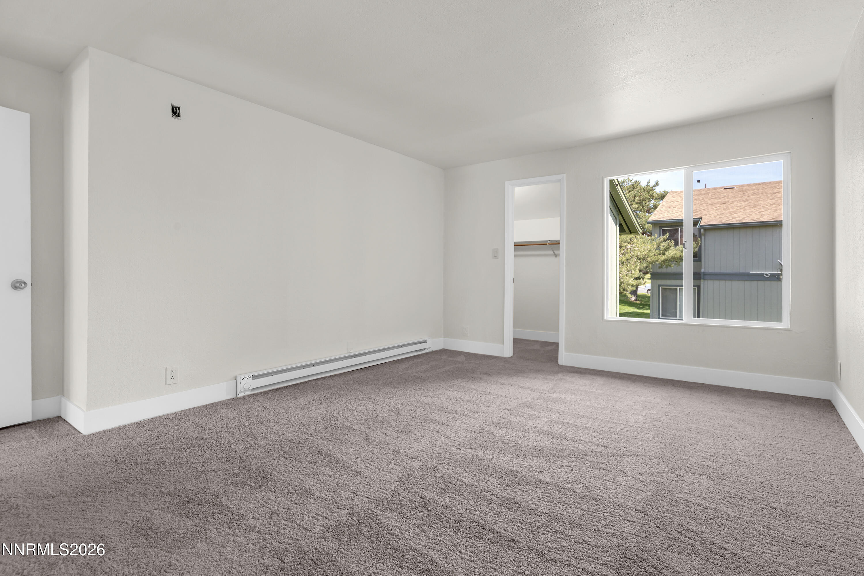 3905 Clear Acre Lane, Unit 26 Reno, NV 89512 - Photo 18 of 27 a view of an empty room with a window