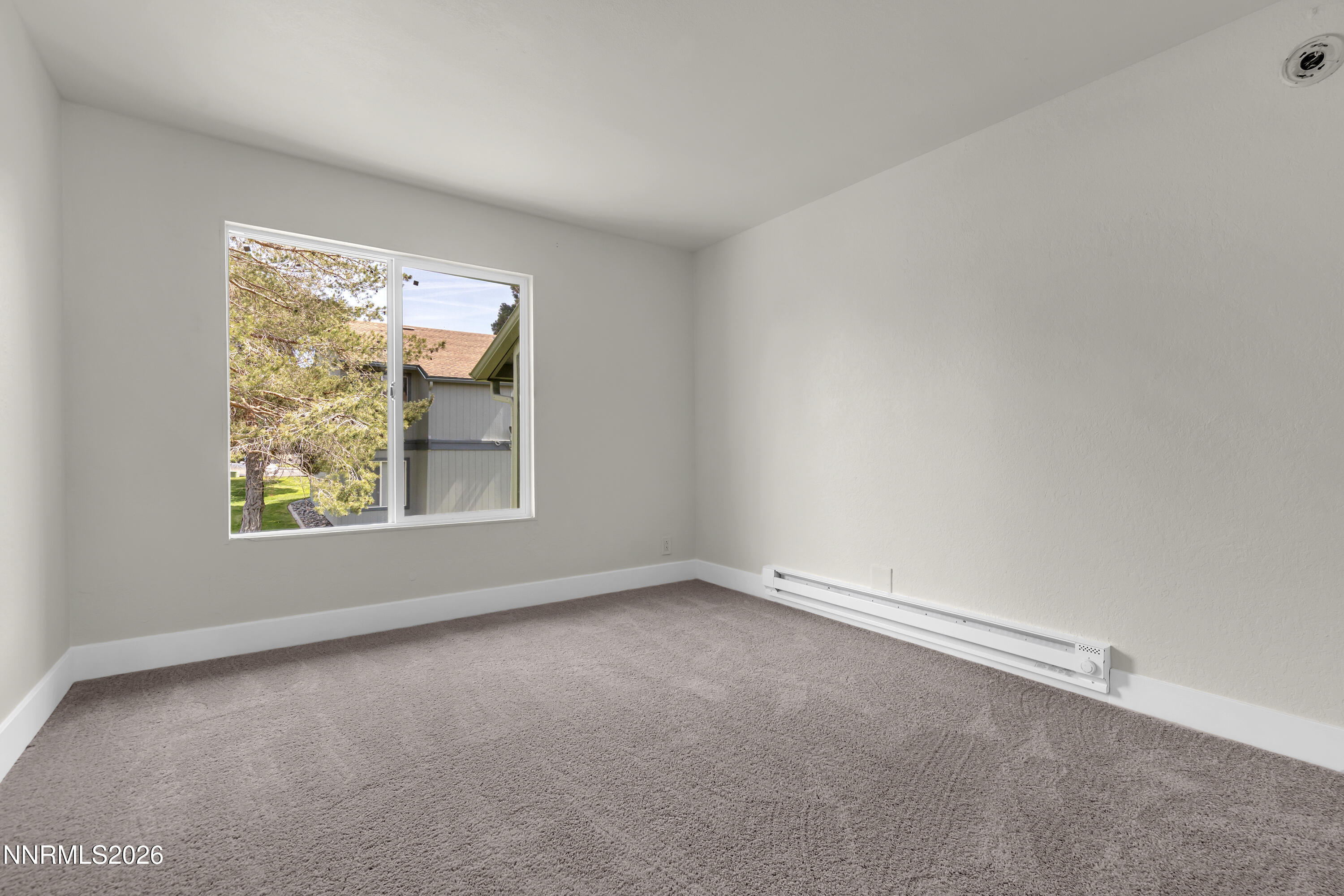 3905 Clear Acre Lane, Unit 26 Reno, NV 89512 - Photo 21 of 27 an empty room with windows
