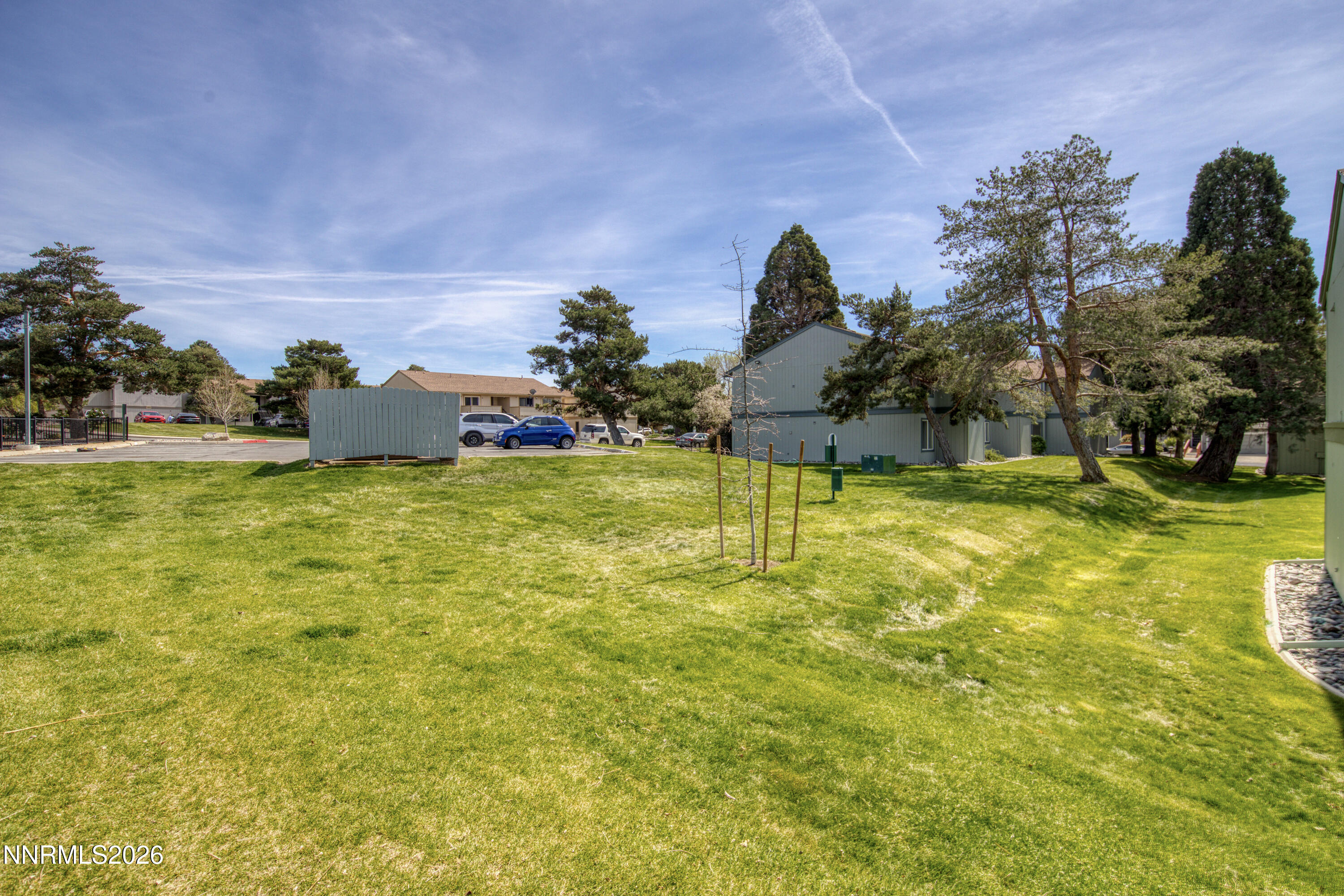 3905 Clear Acre Lane, Unit 26 Reno, NV 89512 - Photo 24 of 27 a view of a swimming pool with a yard