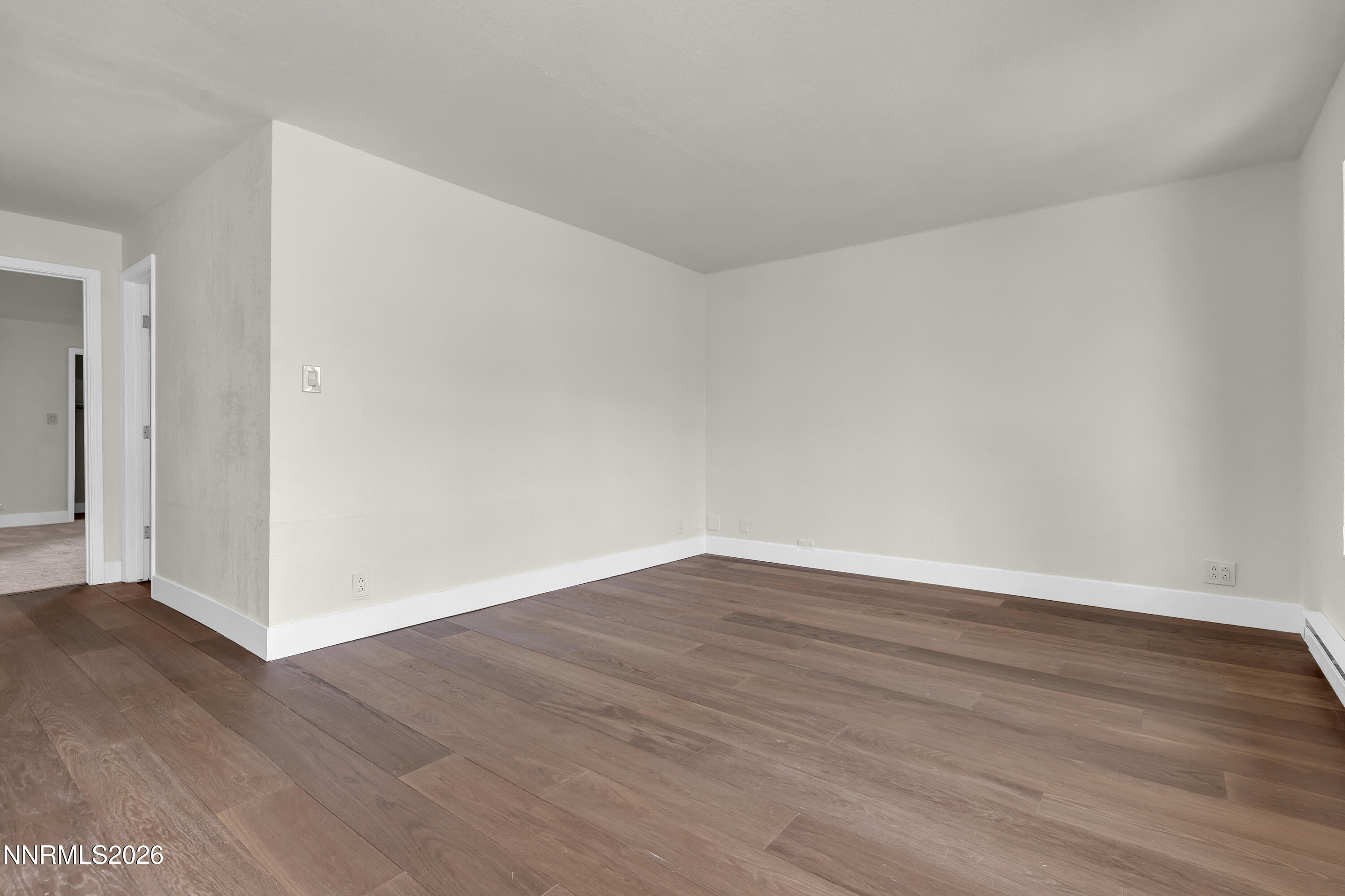 3905 Clear Acre Lane, Unit 26 Reno, NV 89512 - Photo 7 of 27 a view of an empty room with wooden floor