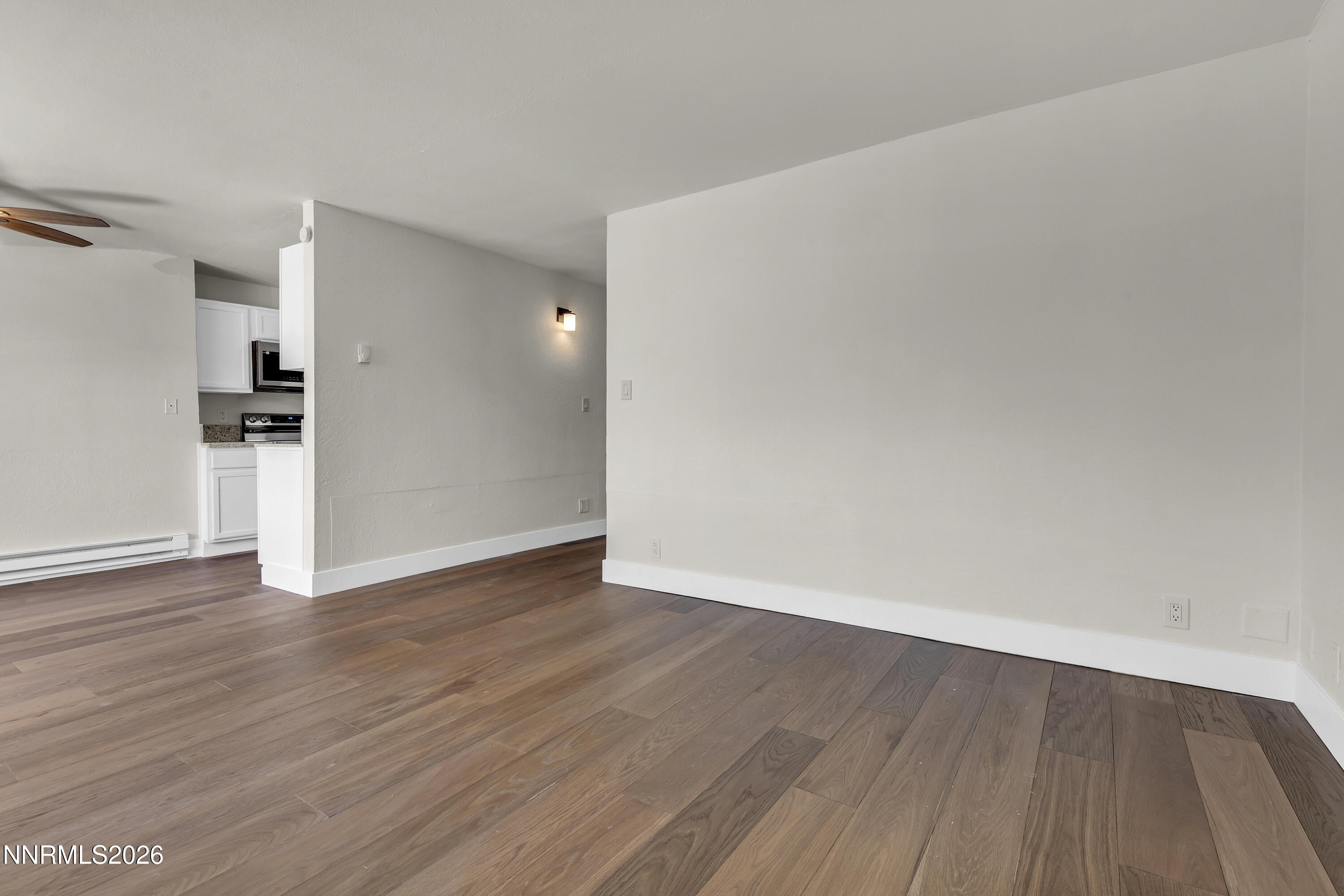 3905 Clear Acre Lane, Unit 26 Reno, NV 89512 - Photo 8 of 27 a view of wooden floor and windows in a room
