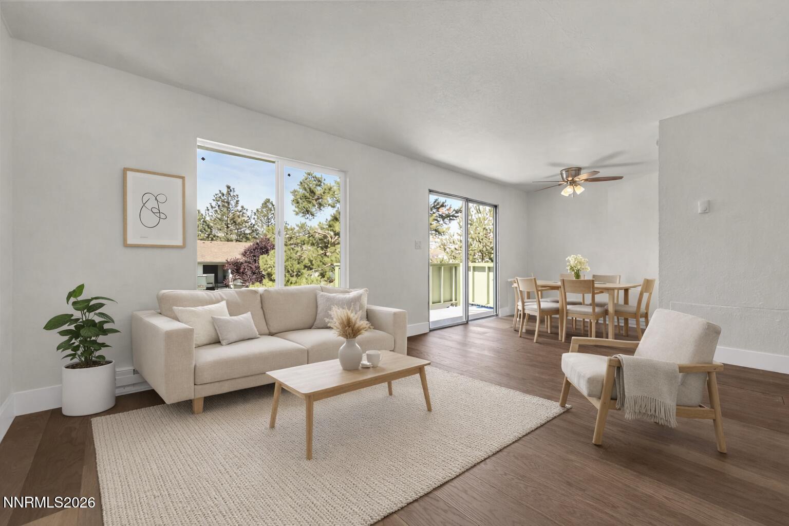 3905 Clear Acre Lane, Unit 26 Reno, NV 89512 - Photo 10 of 27 a living room with furniture and a large window