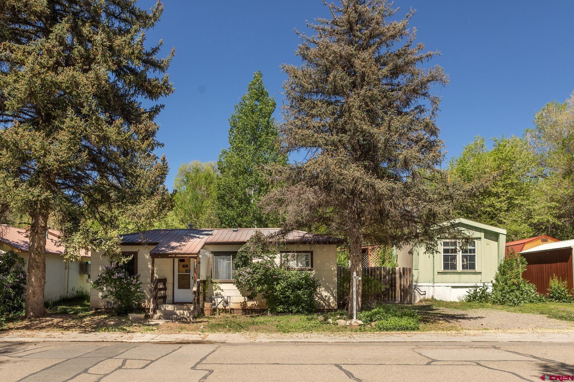 875 Browning Avenue Ignacio, CO 81137 - Photo 1 of 24 front view of a house with a tree