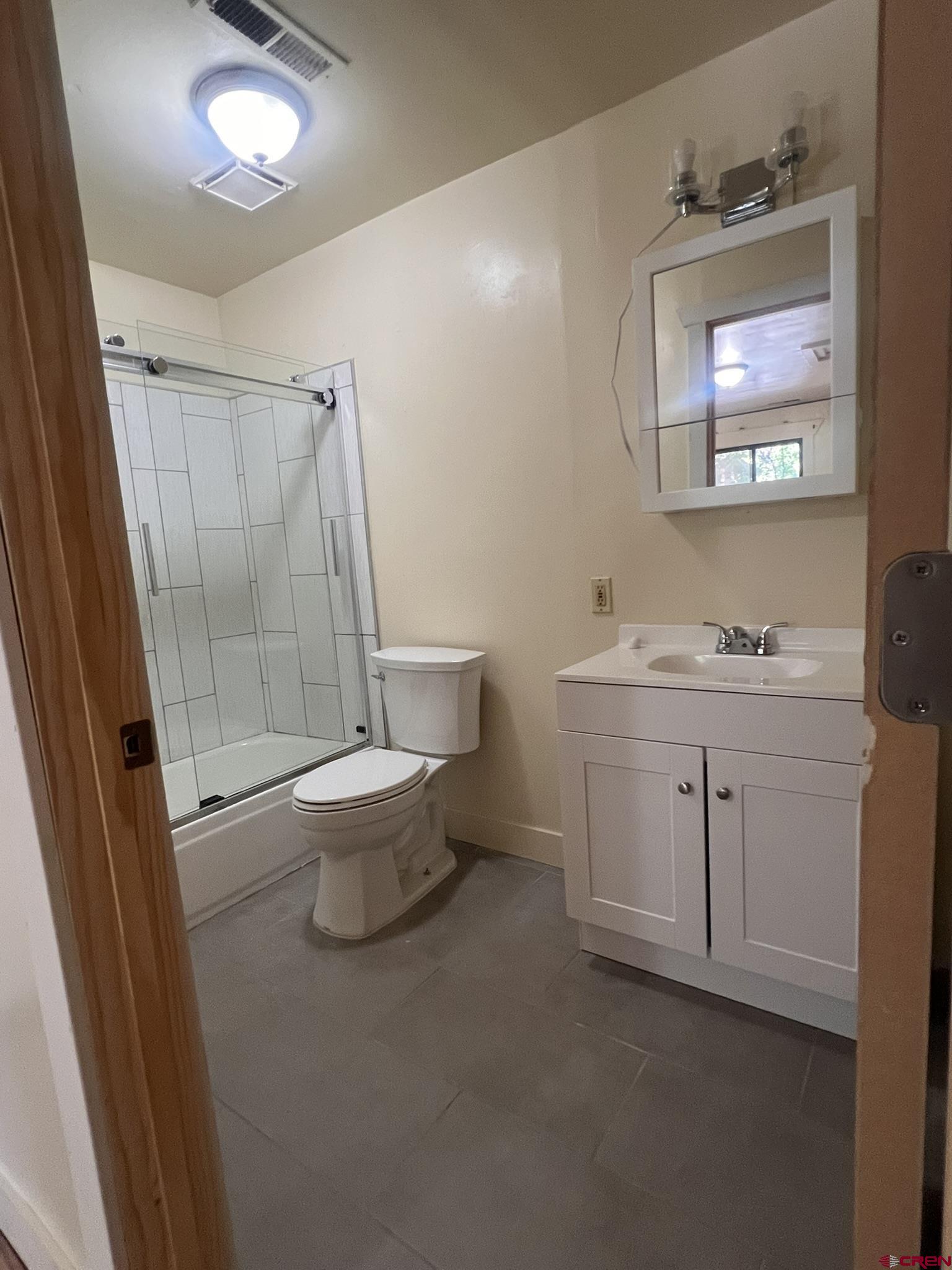 875 Browning Avenue Ignacio, CO 81137 - Photo 11 of 24 a bathroom with a toilet sink and mirror