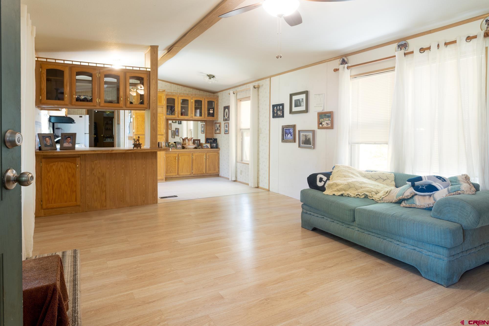 875 Browning Avenue Ignacio, CO 81137 - Photo 13 of 24 a living room with furniture and a large window